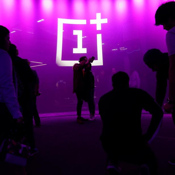 The OnePlus logo is projected onto a wall during a launch event for the new OnePlus 6T in the Manhattan borough of New York