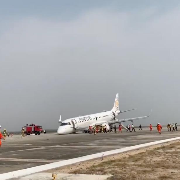 View after Myanmar National Airlines flight UB103 landed without a front wheel at Mandalay International Airport in Tada-U