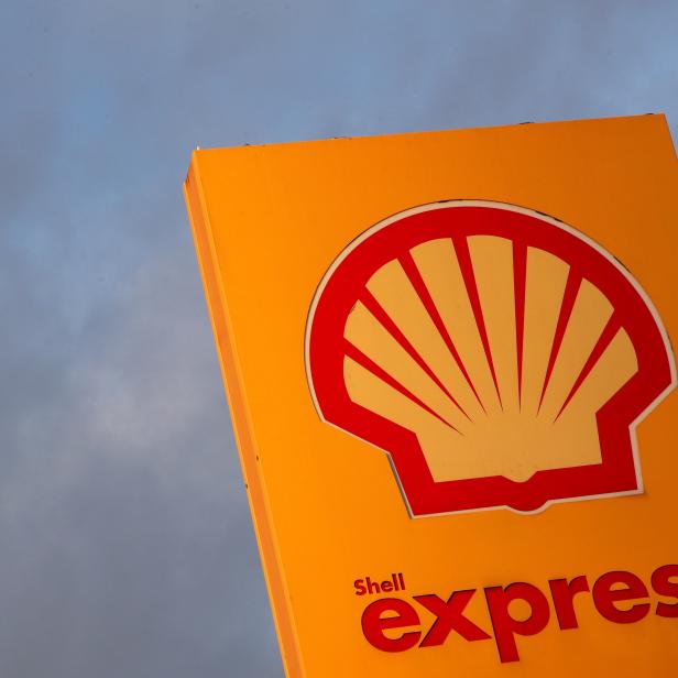 FILE PHOTO: The logo of Royal Dutch Shell is seen at a petrol station in Sint-Pieters-Leeuw