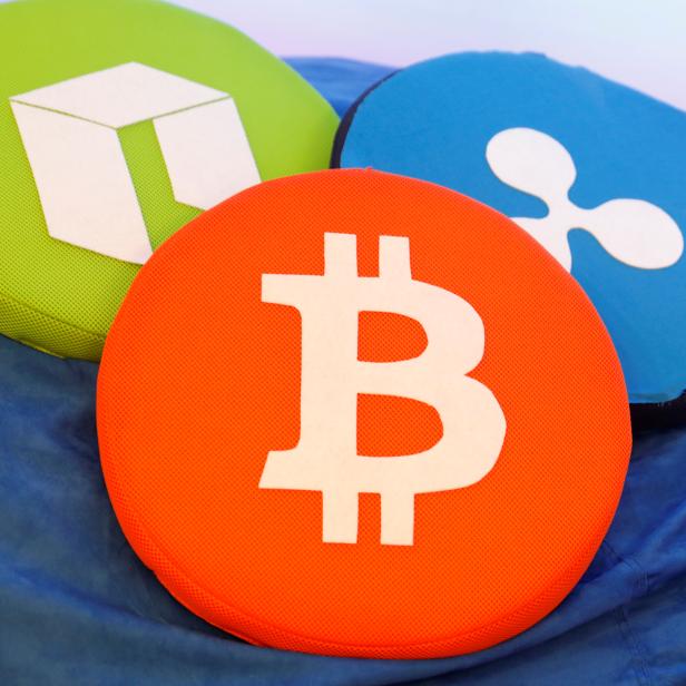 FILE PHOTO: The Bitcoin logo is seen on a pillow on display at the Consensus 2018 blockchain technology conference in New York City