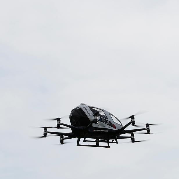 People attend a test flight for Ehang 216 in Vienna