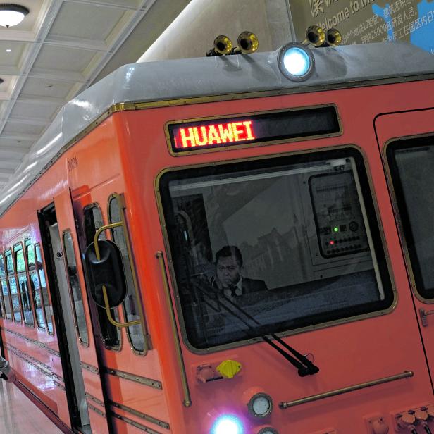 An employee enters a train in the Huawei's Ox Horn campus at Songshan Lake in Dongguan, Guangdong province