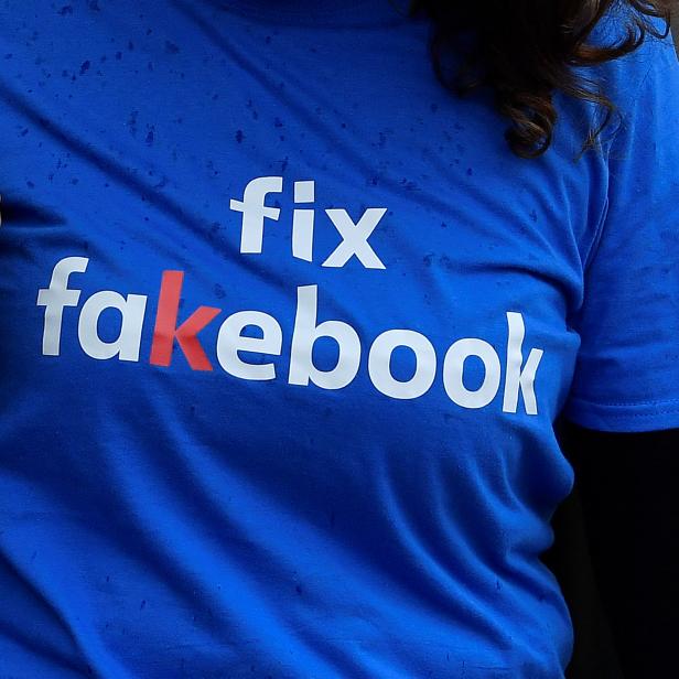 A campaigner from a political pressure group protests as founder and CEO of Facebook Mark Zuckerberg failed to attend a meeting on fake news held by Parliament's Digital, Culture Media and Sport committee in London