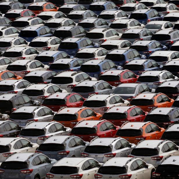 Newly manufactured cars of the automobile maker Subaru await export in a port in Yokohama