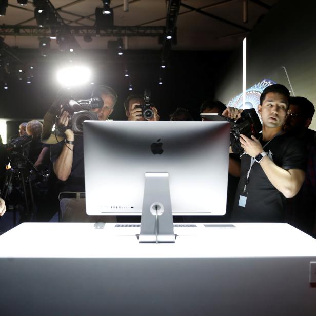 FILE PHOTO: Members of the media photograph a prototype iMac Pro during the annual Apple Worldwide Developer Conference (WWDC) in San Jose