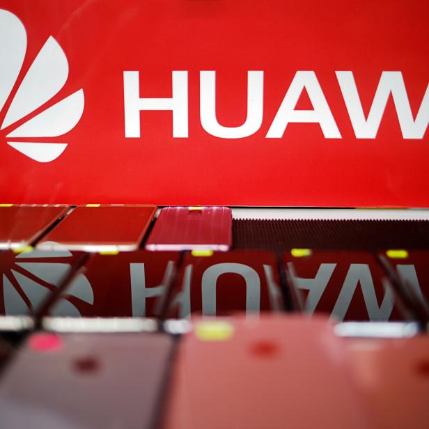 FILE PHOTO: The logo of Huawei is pictured at a mobile phone shop in Singapore