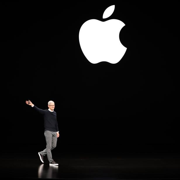 Tim Cook, CEO of Apple, waves to attendees during an Apple special event at the Steve Jobs Theater in Cupertino