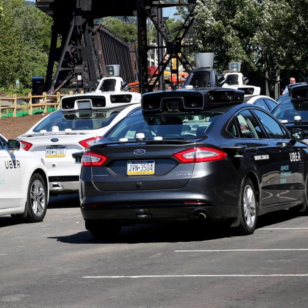 A fleet of Uber's Ford Fusion self driving cars are shown during a demonstration of self-driving automotive technology in Pittsburgh