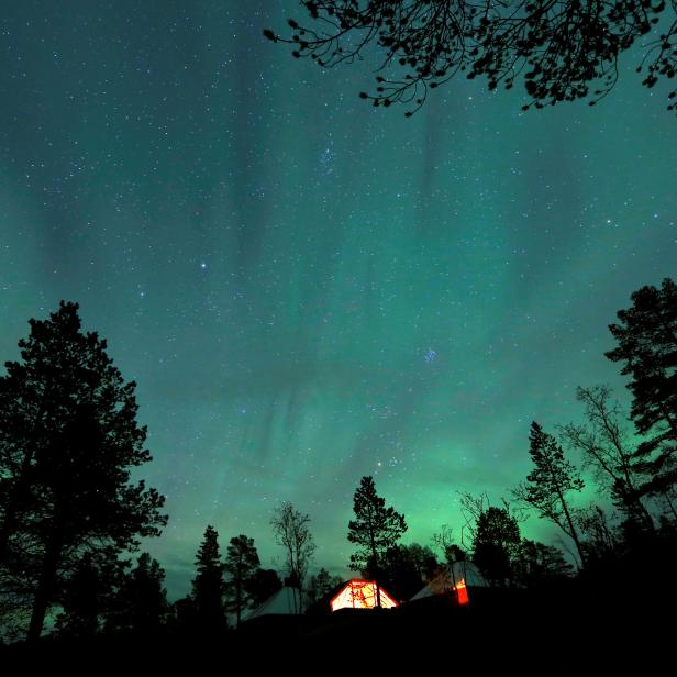 FILE PHOTO: The Aurora Borealis (Northern Lights) is seen over a mountain camp north of the Arctic Circle