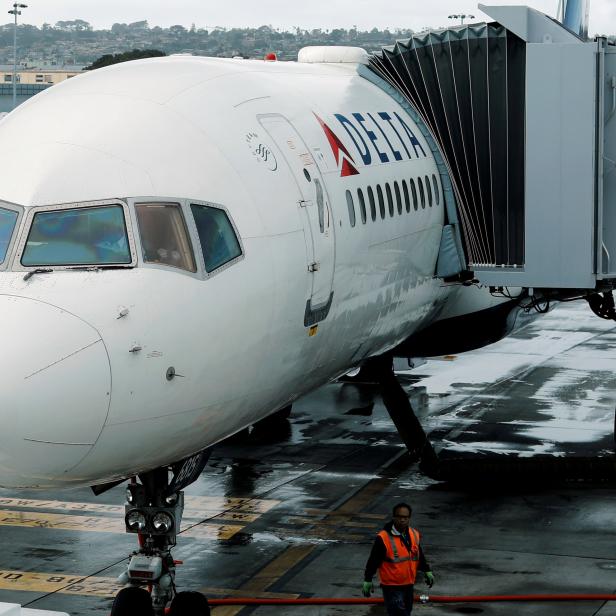 FILE PHOTO: A Delta Airlines plane is seen at a gate in San Diego