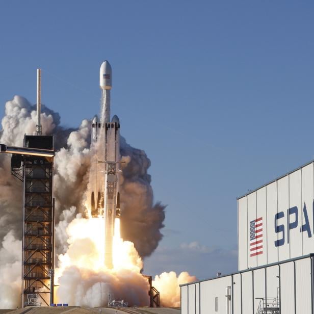 A SpaceX Falcon Heavy rocket, carrying the Arabsat 6A communications satellite, lifts off from the Kennedy Space Center