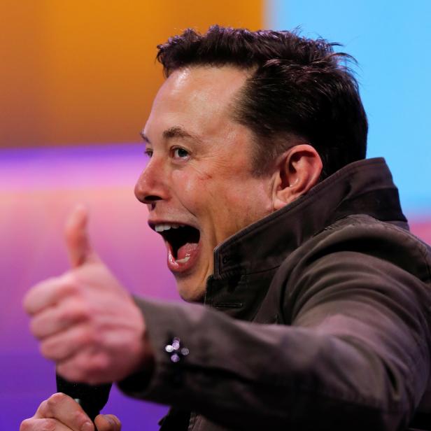 SpaceX owner and Tesla CEO Elon Musk gestures during a conversation with legendary game designer Todd Howard at the E3 gaming convention in Los Angeles