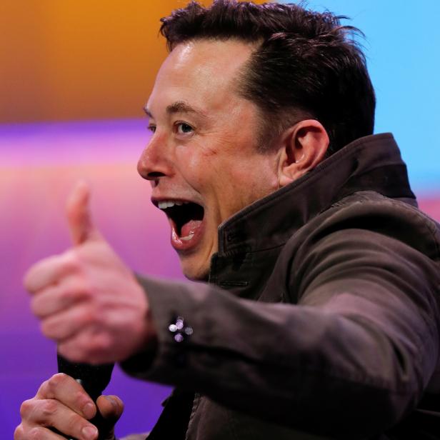 SpaceX owner and Tesla CEO Elon Musk gestures during a conversation with legendary game designer Todd Howard at the E3 gaming convention in Los Angeles