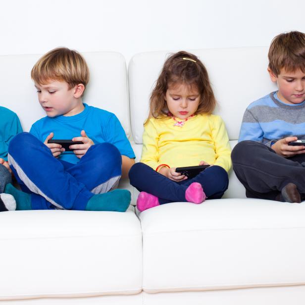 Children playing games on cellphones