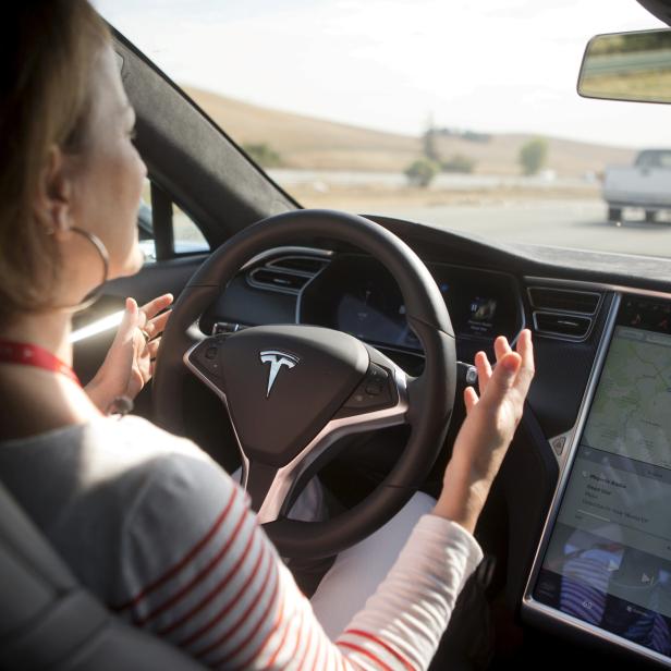 FILE PHOTO -New Autopilot features are demonstrated in a Tesla Model S during a Tesla event in Palo Alto, California