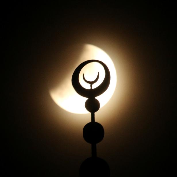 The moon is seen during a partial lunar eclipse in Yevpatoriya