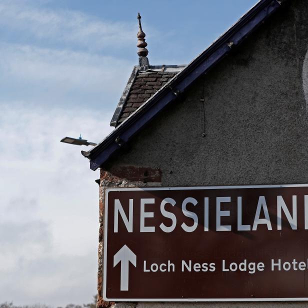 A sign for Nessieland is seen on a building near Loch Ness, Scotland