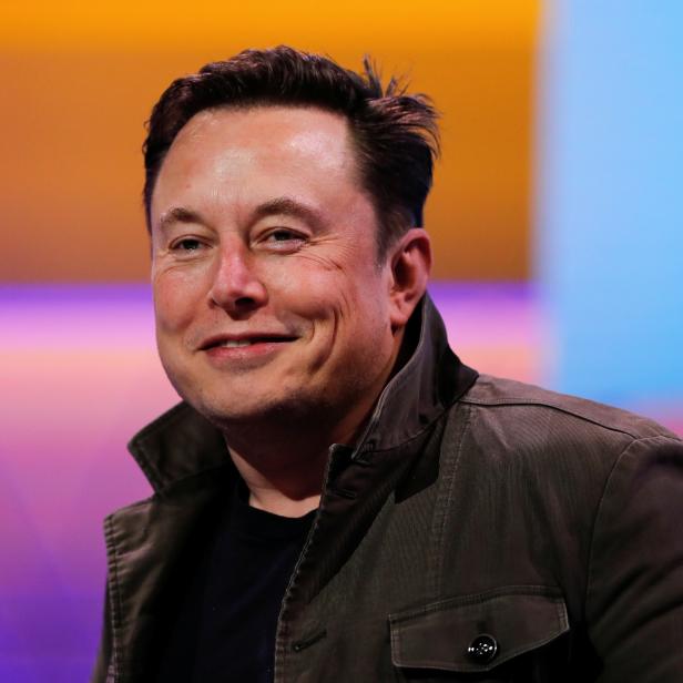 SpaceX owner and Tesla CEO Elon Musk smiles during a conversation with legendary game designer Todd Howard at the E3 gaming convention in Los Angeles