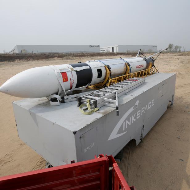 LinkSpaces reusable rocket RLV-T5, also known as NewLine Baby, is transported to a vacant plot of land for a test launch in Longkou