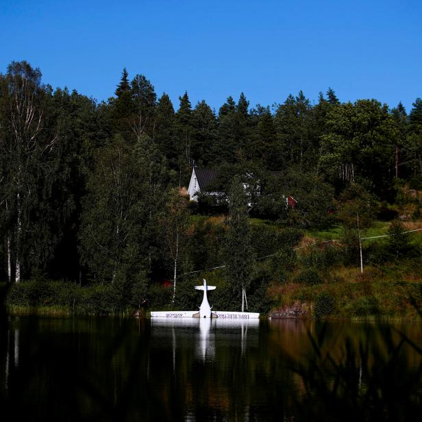 Norway's first battery-powered aircraft piloted by Avinor Chief Executive Dag Falk-Petersen is seen partly submerged in a lake after crash-landing, in Nornestjonn, Arendal