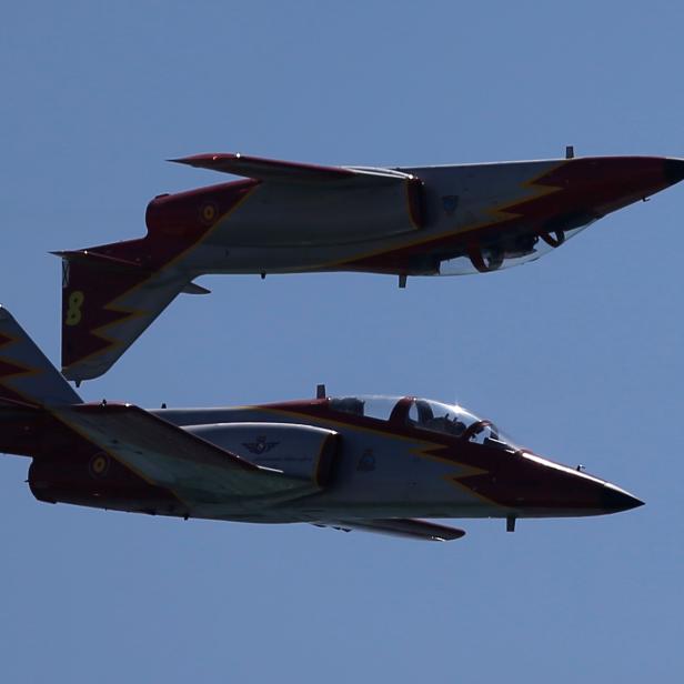 Casa C-101 Aviojets from the Spanish Air Force aerobatic group Patrulla Aguila fly during an international aerial and naval military exhibition in Rota