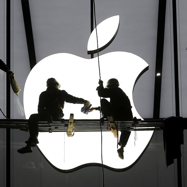 File photo of workers preparing for the opening of an Apple store in Hangzhou