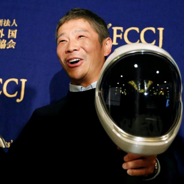 Japanese billionaire Maezawa, founder and chief executive of online fashion retailer Zozo, who has been chosen as the first private passenger by SpaceX, poses for photos as he attends a news conference in Tokyo