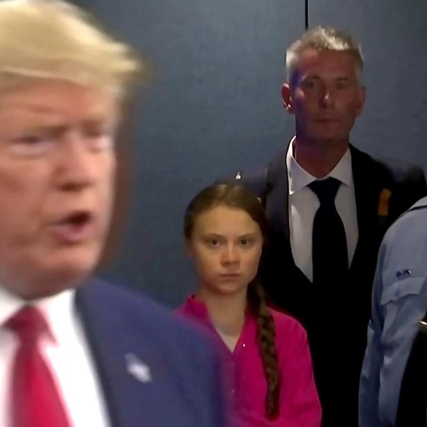 Swedish environmental activist Greta Thunberg watches as U.S. President Donald Trump enters the United Nations