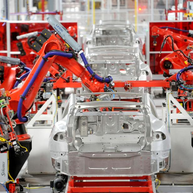 FILE PHOTO: Robotic arms assemble Tesla's Model S sedans at the company's factory in Fremont