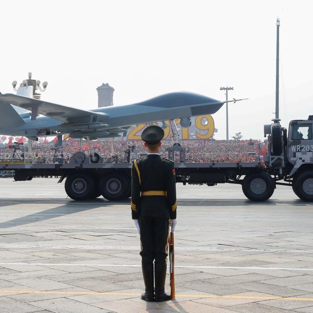 Military vehicle carrying a drone travels past Tiananmen Square during the military parade marking the 70th founding anniversary of People's Republic of China, on its National Day in Beijing