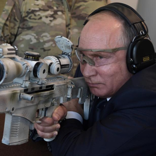 Russian President Putin aims a Chukavin sniper rifle SVCh-308 at Patriot military theme park outside Moscow