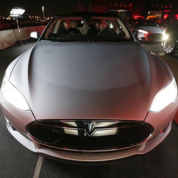 New all-wheel-drive versions of the Tesla Model S car are lined up for test drives in Hawthorne, California