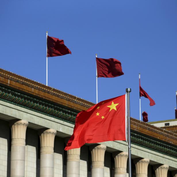 FILE PHOTO: Chinese flag waves in front of the Great Hall of the People in Beijing