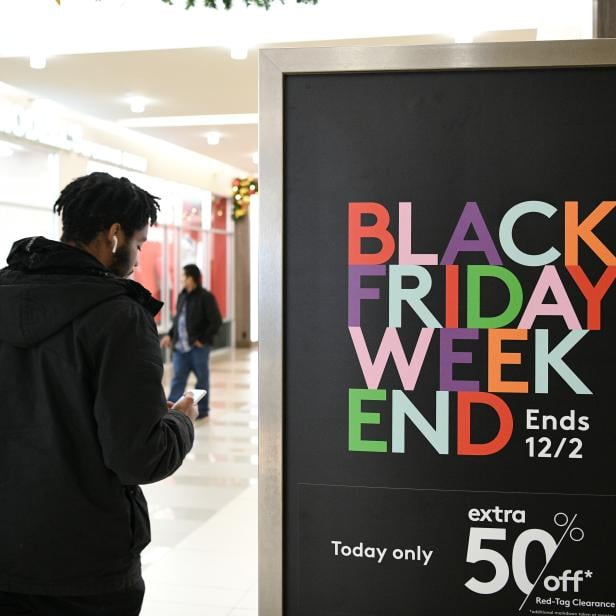 Holiday shoppers look for deals during the Black Friday sales event at the Pentagon Centre shopping mall in Arlington