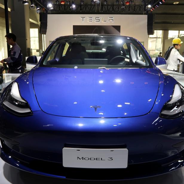 FILE PHOTO: China-made Tesla Model 3 electric vehicle is seen ahead of the Guangzhou auto show in Guangzhou