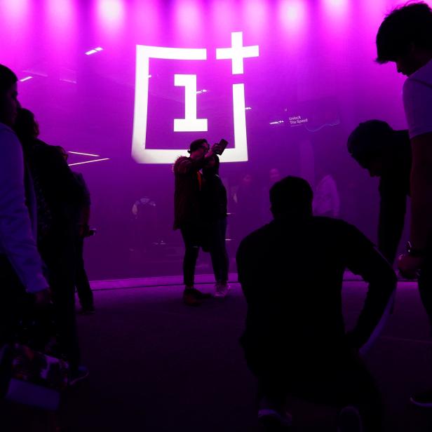 The OnePlus logo is projected onto a wall during a launch event for the new OnePlus 6T in the Manhattan borough of New York