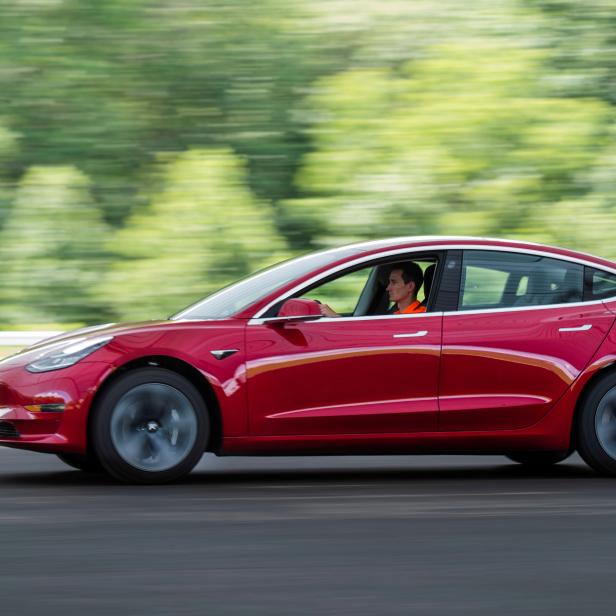 FILE PHOTO: IIHS media relations associate Young drives a Tesla Model 3 at IIHS-HLDI Vehicle Research Center in Ruckersville, Virginia