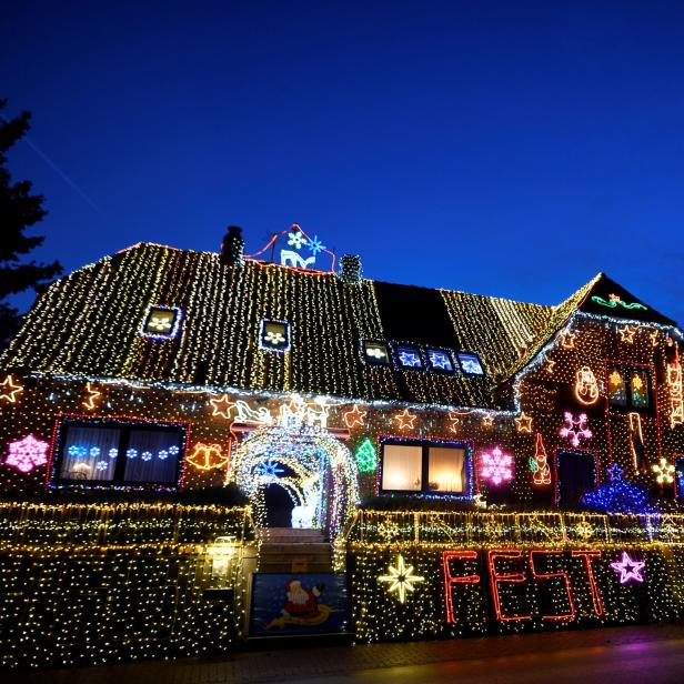 A house is illuminated ahead of Christmas in Calle, Lower Saxony