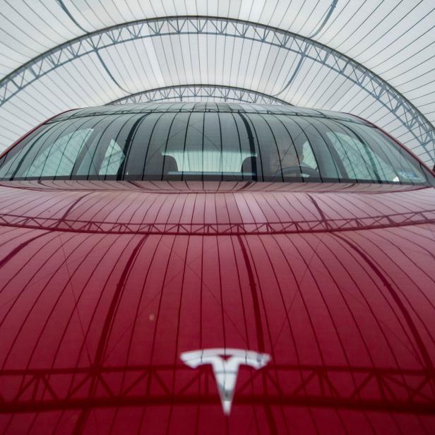 FILE PHOTO: IIHS technician Floyd demonstrates front crash prevention test on Tesla Model 3 at IIHS-HLDI Vehicle Research Center in Ruckersville, Virginia