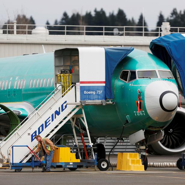 FILE PHOTO: An employee works near a Boeing 737 Max aircraft at Boeing's 737 Max production facility in Renton