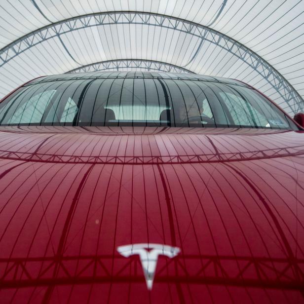 FILE PHOTO: IIHS technician Floyd demonstrates front crash prevention test on Tesla Model 3 at IIHS-HLDI Vehicle Research Center in Ruckersville, Virginia