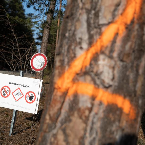 Unexploded ordnance warning signs are seen in the area where the U.S. electric vehicle pioneer Tesla will build its first European factory and design center in Gruenheide near Berlin