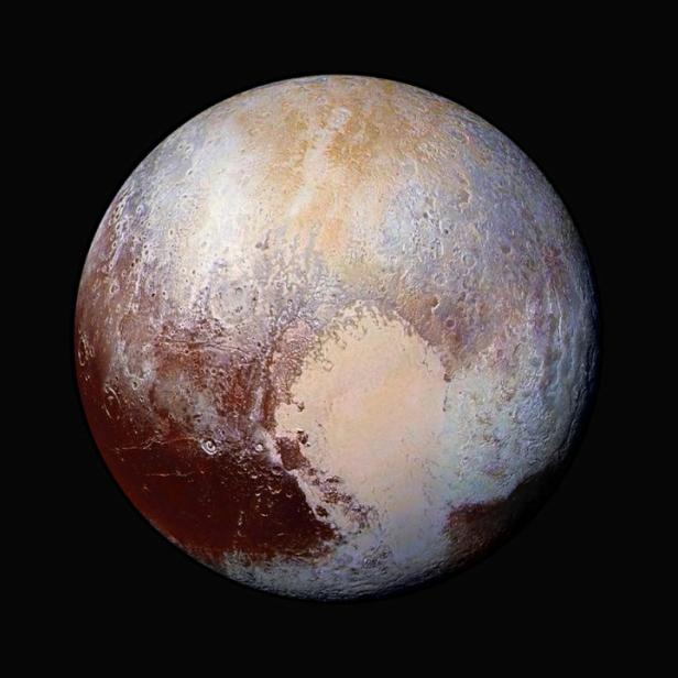 The planet Pluto is pictured in a handout image made up of four images from New Horizons' Long Range Reconnaissance Imager (LORRI) taken in July 2015 combined with color data from the Ralph instrument to create this enhanced color global view