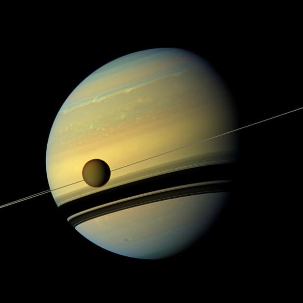 FILE PHOTO: Handout of Titan, Saturn's largest moon in this natural color view from NASA's Cassini spacecraft