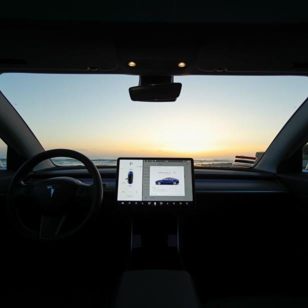 The interior of a 2018 Tesla Model 3 electric vehicle is shown in Cardiff