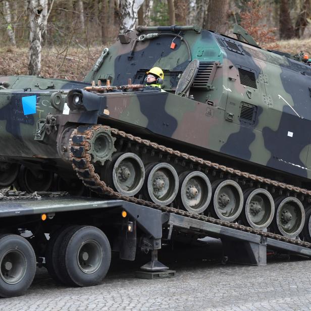 Soldiers of German Army Bundeswehr load a U.S. M992 support vehicle tank onto a heavy goods transporter during preparations for the Defender-Europe 20 international military exercises in Bergen Hohne