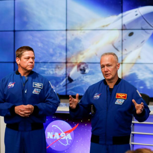 NASA astronauts Doug Hurley (R) and Bob Behnken speak at a news conference