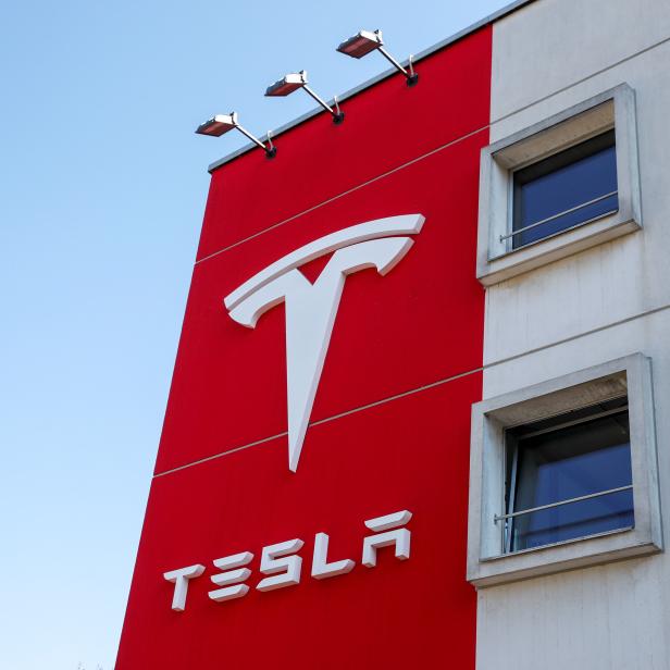 Logo of Tesla is seen at a branch office in Bern