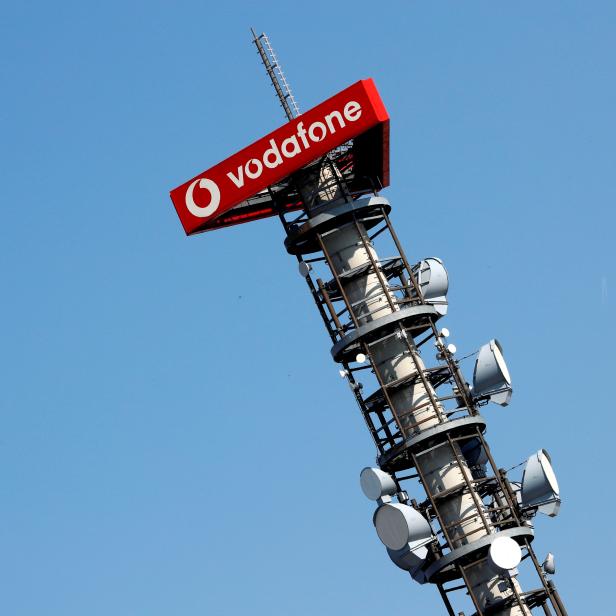 FILE PHOTO: Different types of 4G, 5G and data radio relay antennas for mobile phone networks on a relay mast operated by Vodafone