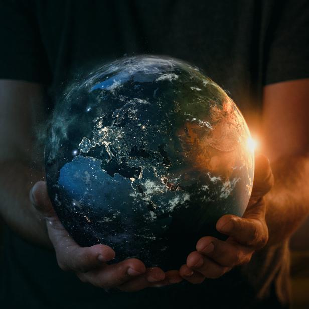 Planet earth in human hand